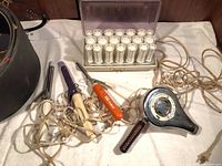 Overview of hot roller set, hair dryer, curling irons and cords