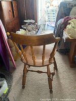 Wood spindle-back armchair rear view showing turned legs and curved arms