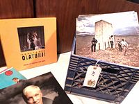 LP box set, Who’s Next LP, Annie Lennox LP in front of blue plastic milk crate