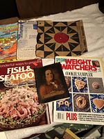 Group shot of magazines, record, comic, framed print