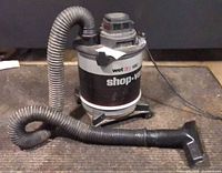 Full view of Shop-Vac with hose and nozzle