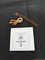 Brooch and bracelet overview on black background