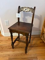 Full view of wooden child chair showing overall design and size