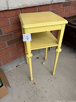 full view of yellow painted side table