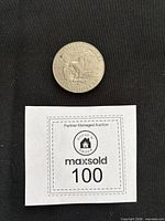 Reverse of Eisenhower dollar showing eagle landing on moon