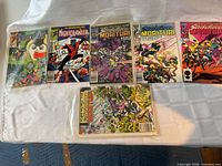 All six bagged Marvel comics laid out