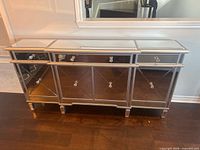 Front view of mirrored sideboard closed