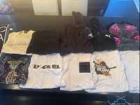 Array of hoodies and T-shirts laid flat on table