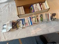 Overview of box and spread-out stacks of NFL cards