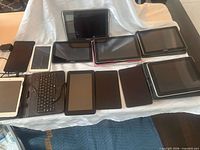 Front view of all 11 tablets laid out on table