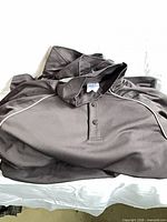 Stacked Sport T men’s golf shirts showing collar, buttons, and fabric