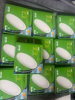 Stack of ten boxed Ortech LED lights