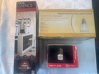 Three boxed pendant light fixtures showing front packaging