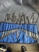 Overall view of all wrenches laid out with roll-up pouch
