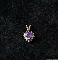 Front view of pendant showing amethyst and diamond halo