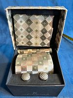 Tie set in presentation box showing pocket square, tie and cufflinks