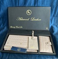Boxed Ashwood Leather travel set opened to show wallet, luggage tag and passport holder