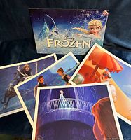 All four lithographs with Frozen presentation folder