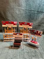 All four packaged Lemax items displayed together