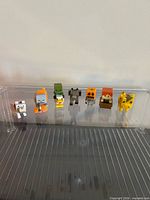 Seven Minecraft mini figures lined up