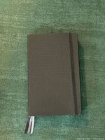 Front cover with elastic band and ribbon markers visible