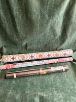 Three wrapped window film rolls with different patterns