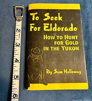 Front cover beside tape measure showing height