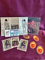 Group shot displaying all brochures, postcards, stickers and Red Wings photo