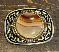 Front view showing agate stone and decorative frame