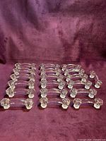 All 19 crystal glass drawer pulls displayed on fabric background