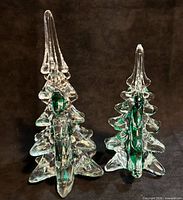 Front view of both glass Christmas tree figurines