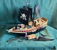 Full view of pirate ship with sails, accessories laid out
