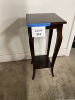 Full view of cherry finish plant stand showing overall design and dimensions reference