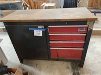 Front view showing entire cabinet, drawers, door, and wood top