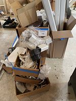 Boxes containing elbows, couplers, straps