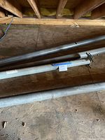 Four steel support posts on attic floor