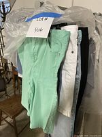 Front view showing mint green shorts and part of rack