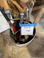 bucket with assorted large hand tools