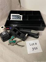 Drawer organizer and assorted office supplies laid out