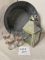 Group view of galvanized tub, four Coors Light glasses, metal lantern