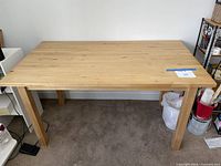 full view of pine table showing legs and overall form