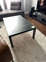 Top and side view of black coffee table