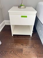 Front view of nightstand showing drawer and shelf