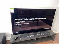 Front view of LG 65-inch OLED TV powered on