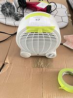 Front view showing intake grill, controls and indicator light