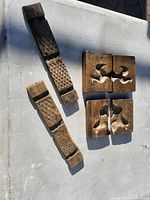 All four mold halves laid out showing dog and rooster cavities and exterior texture