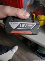 Front label showing BOSCH logo, 18V 4.0Ah Li-ion spec, scuffed housing
