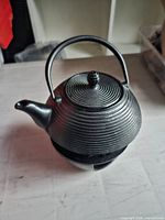 Teapot on stand showing overall form and finish