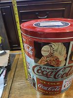 Side view showing Coca-Cola graphics and height measurement