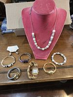 Full lot overview showing all eight jewelry pieces